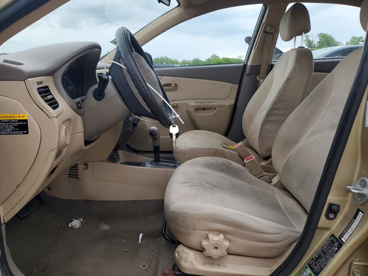 2009 Kia Rio Base Beige vin: KNADE223396519198