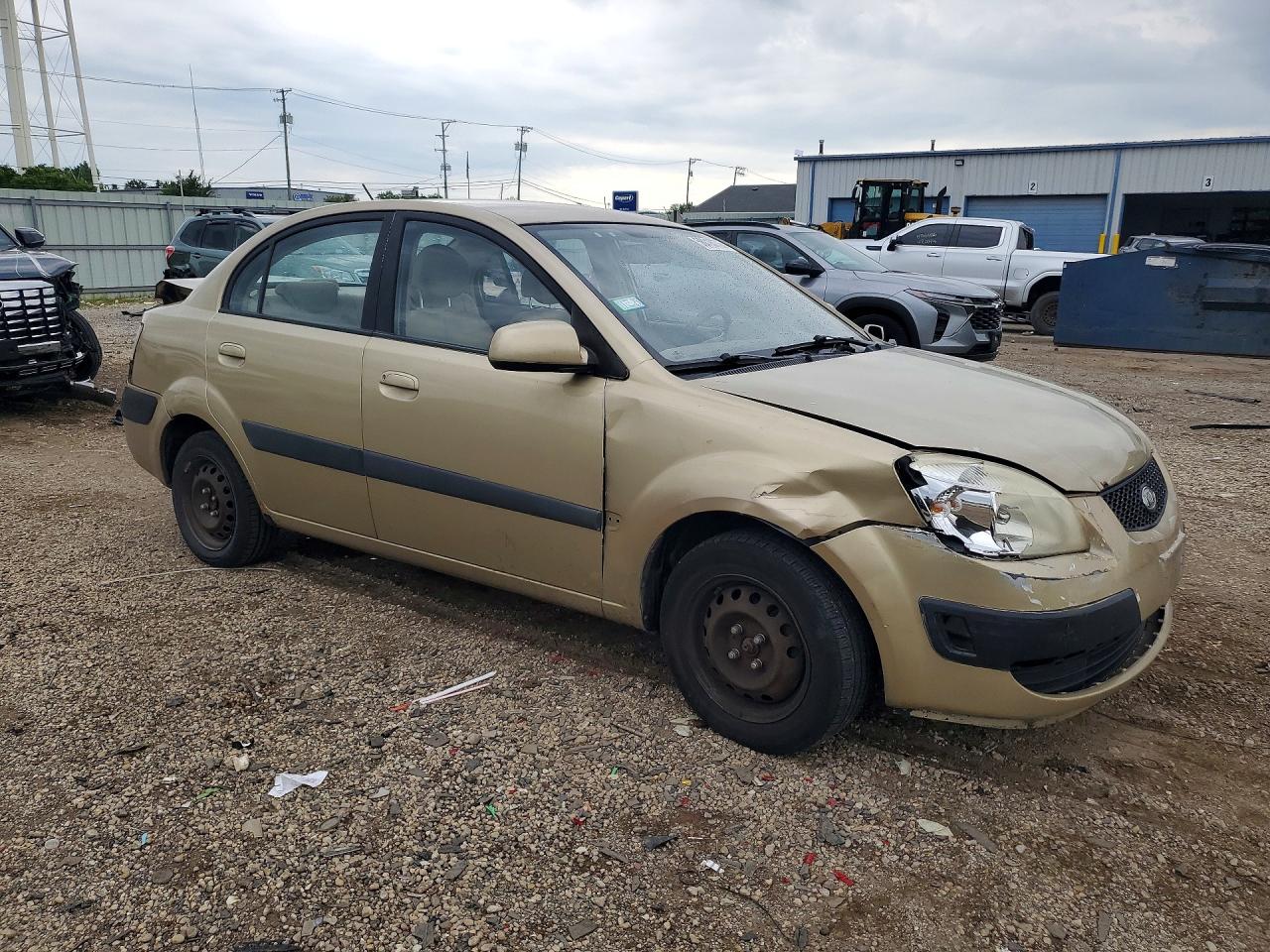 2009 Kia Rio Base Beige vin: KNADE223396519198
