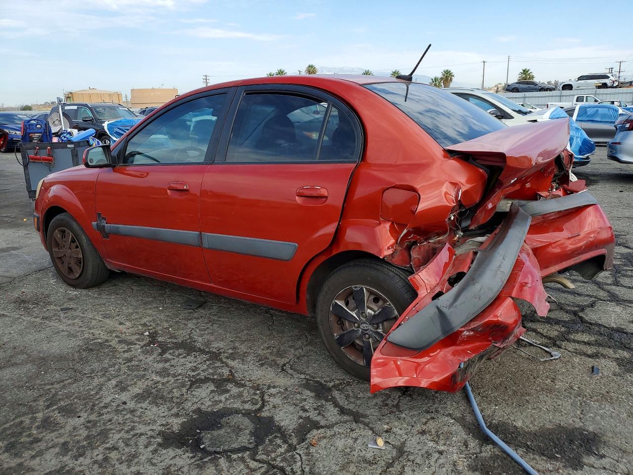 2009 Kia Rio Base Orange vin: KNADE223396573617