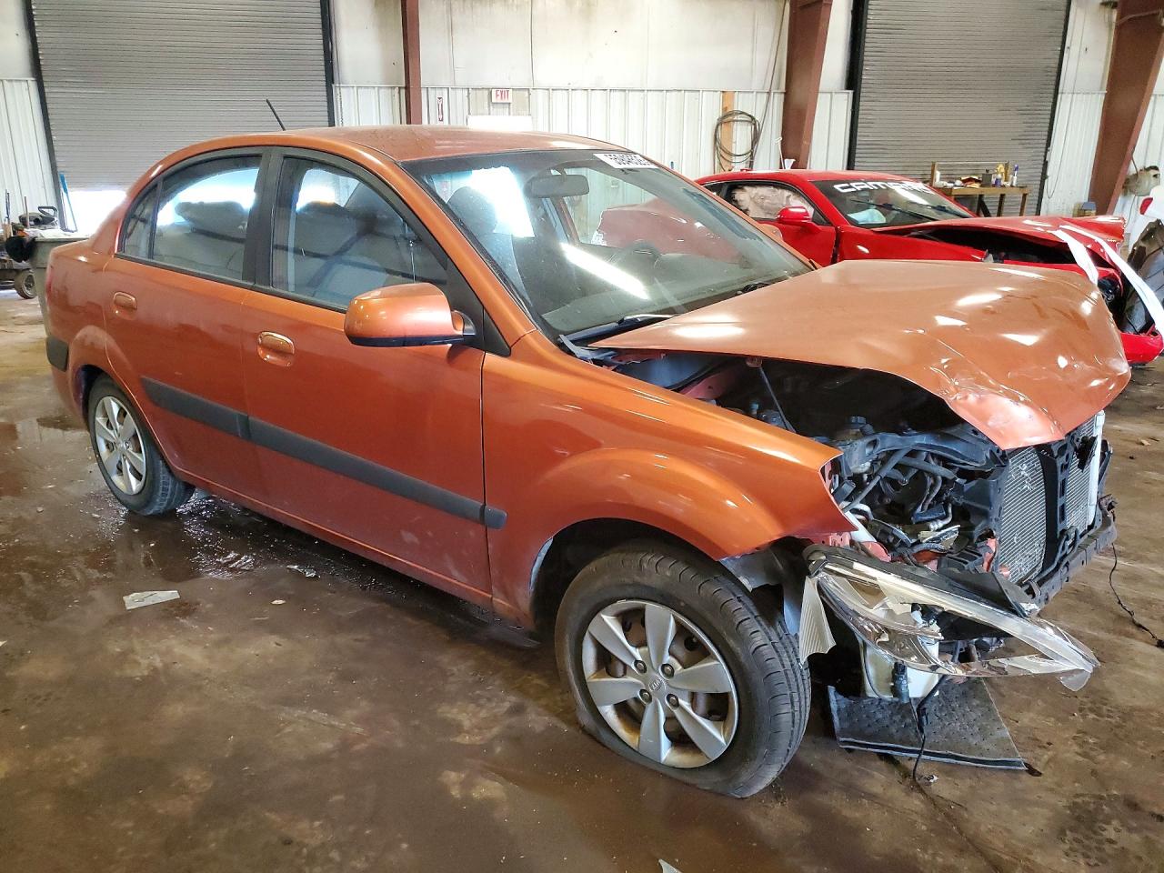 2009 Kia Rio Base Orange vin: KNADE223496459481