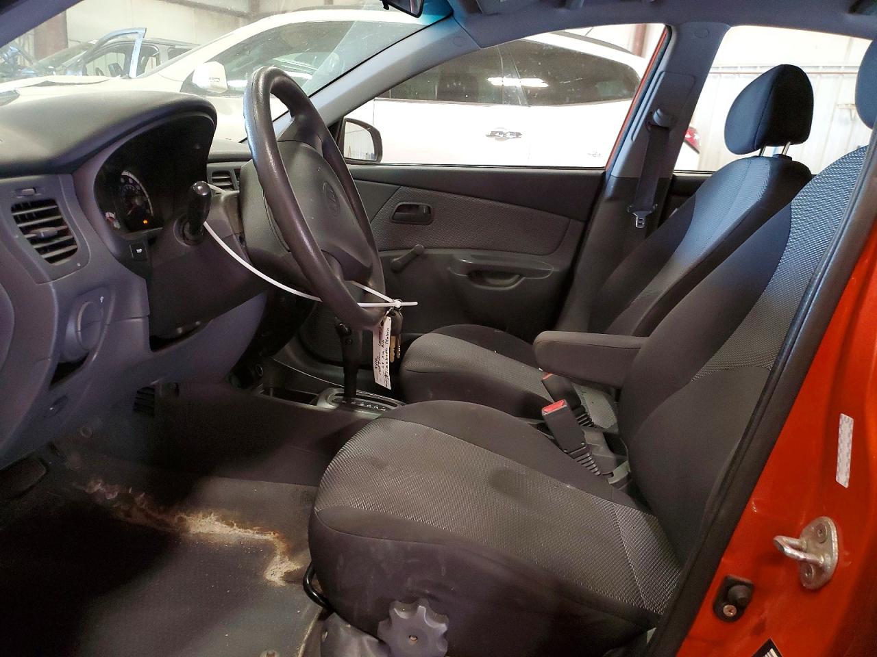 2009 Kia Rio Base Orange vin: KNADE223496459481
