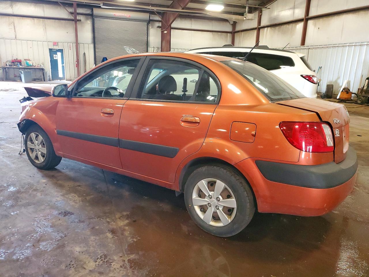 2009 Kia Rio Base Orange vin: KNADE223496459481
