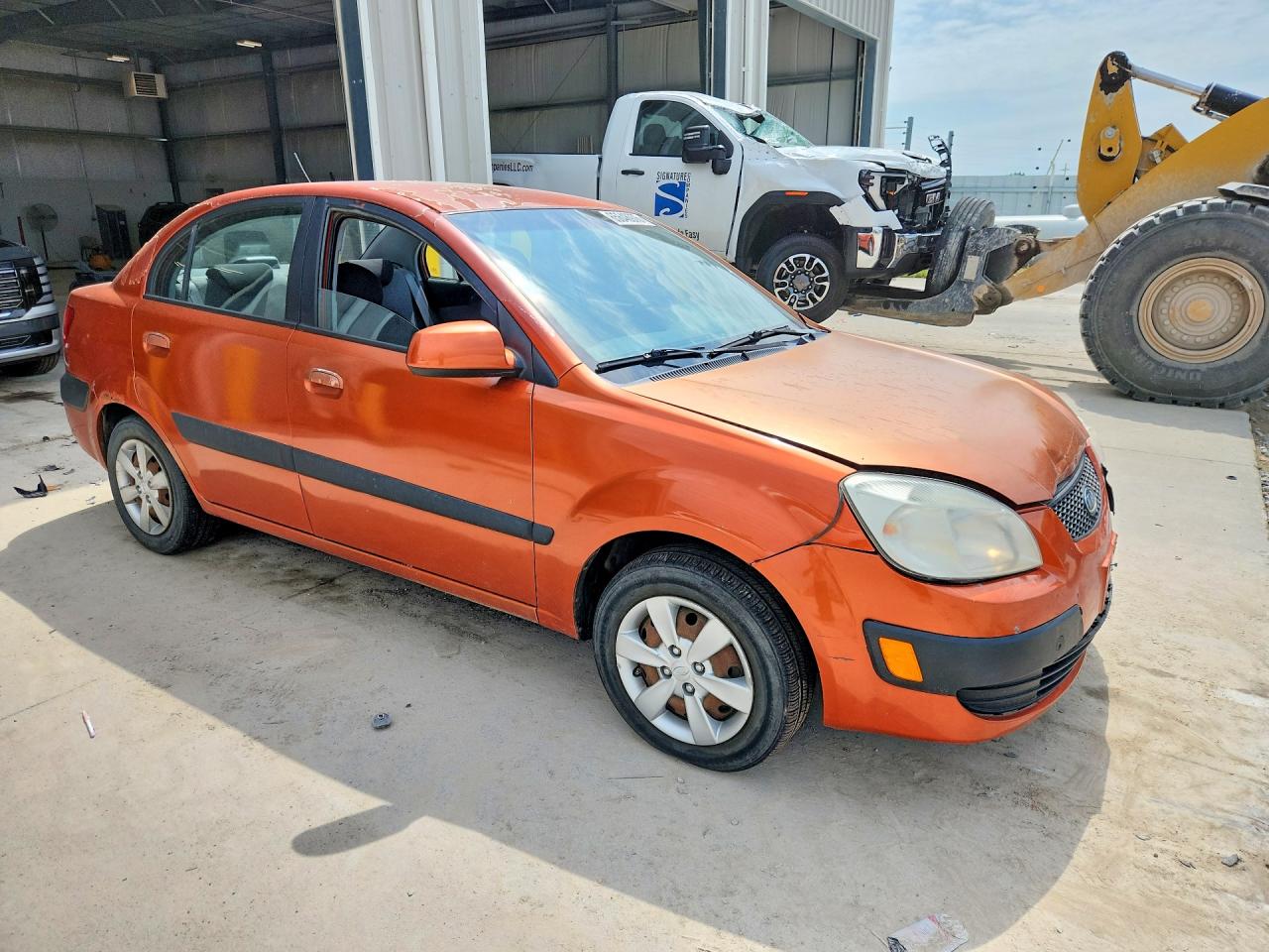 2009 Kia Rio Base Orange vin: KNADE223496534261