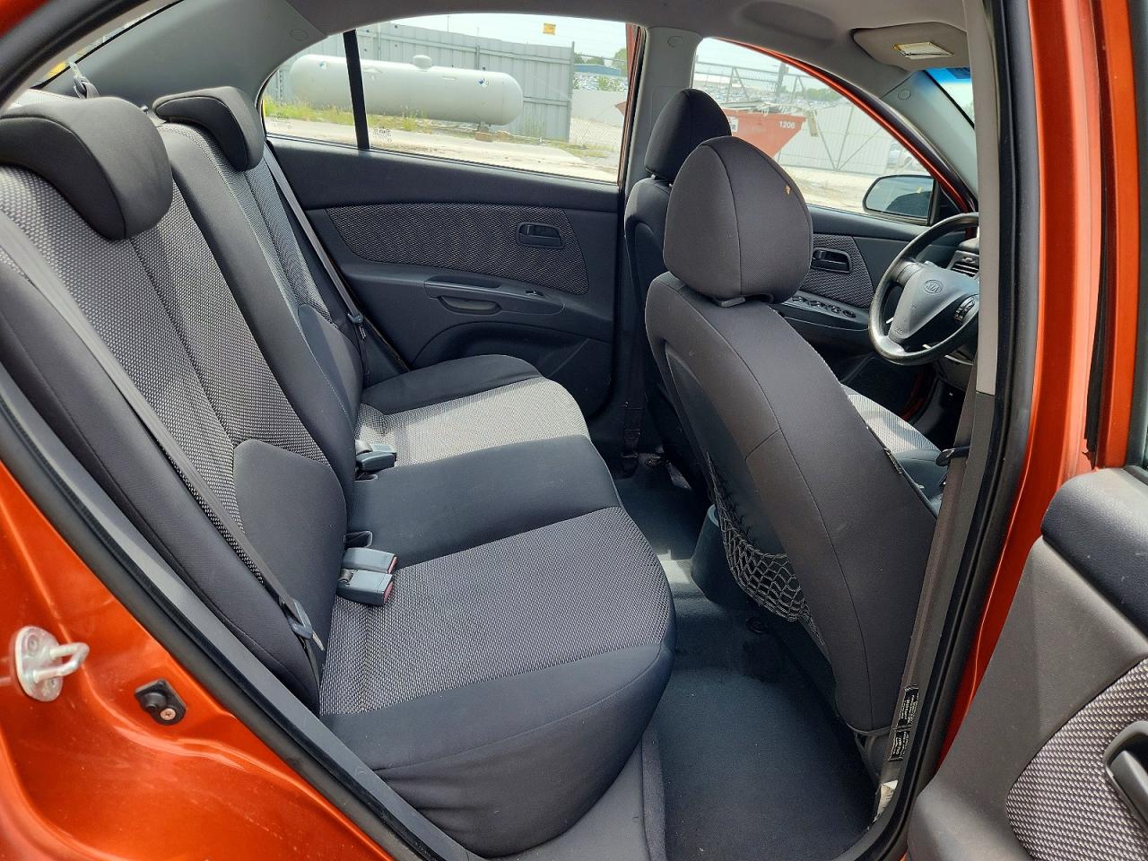 2009 Kia Rio Base Orange vin: KNADE223496534261