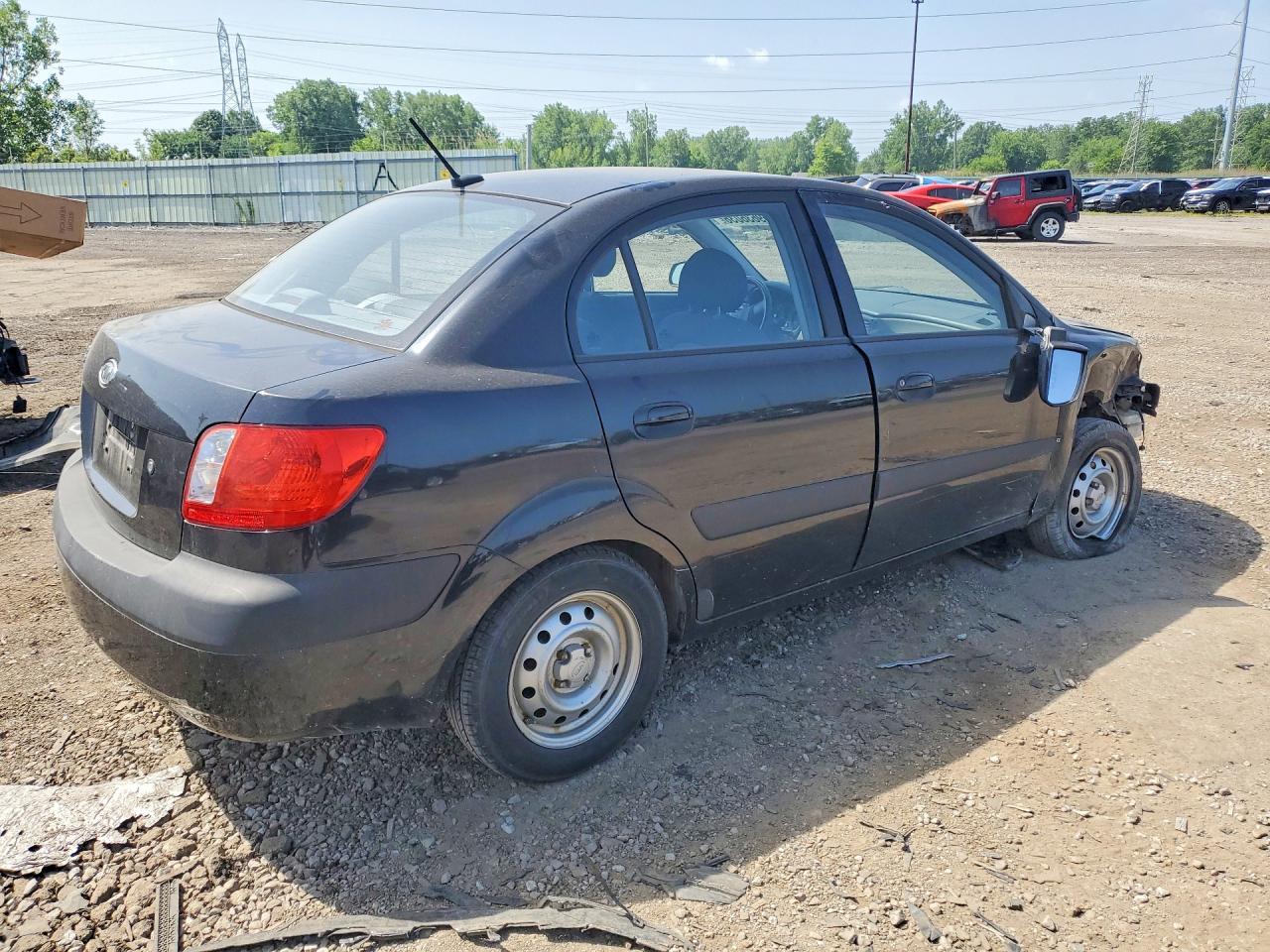 2009 Kia Rio Base Black vin: KNADE223596547987