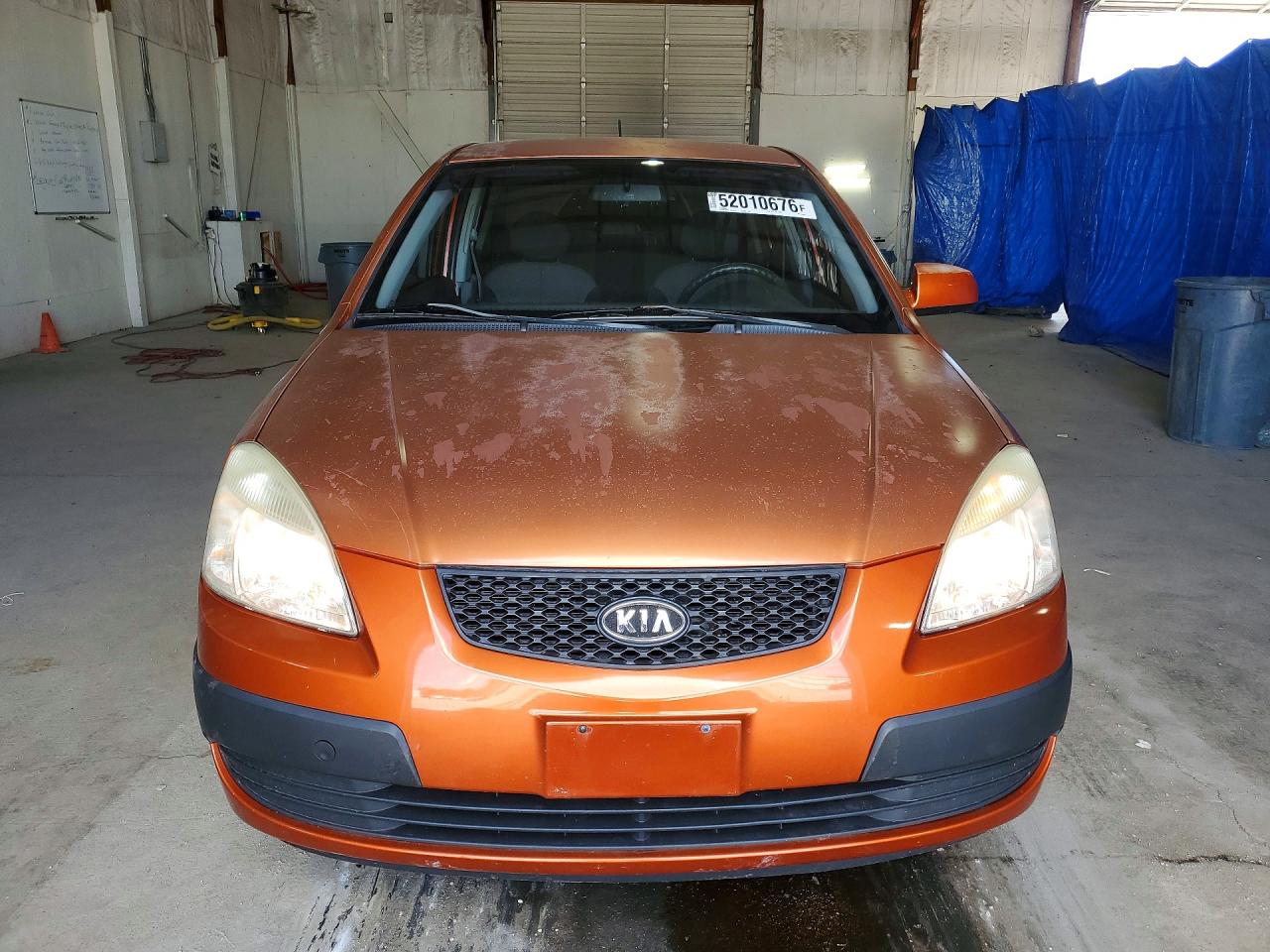 2009 Kia Rio Base Orange vin: KNADE223796534285