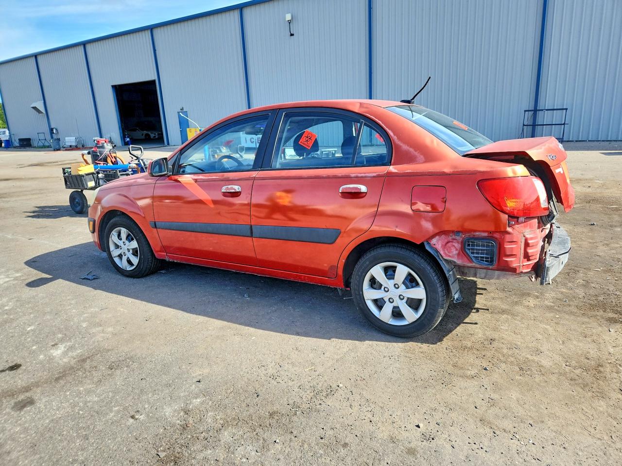2009 Kia Rio Base Orange vin: KNADE223896447463