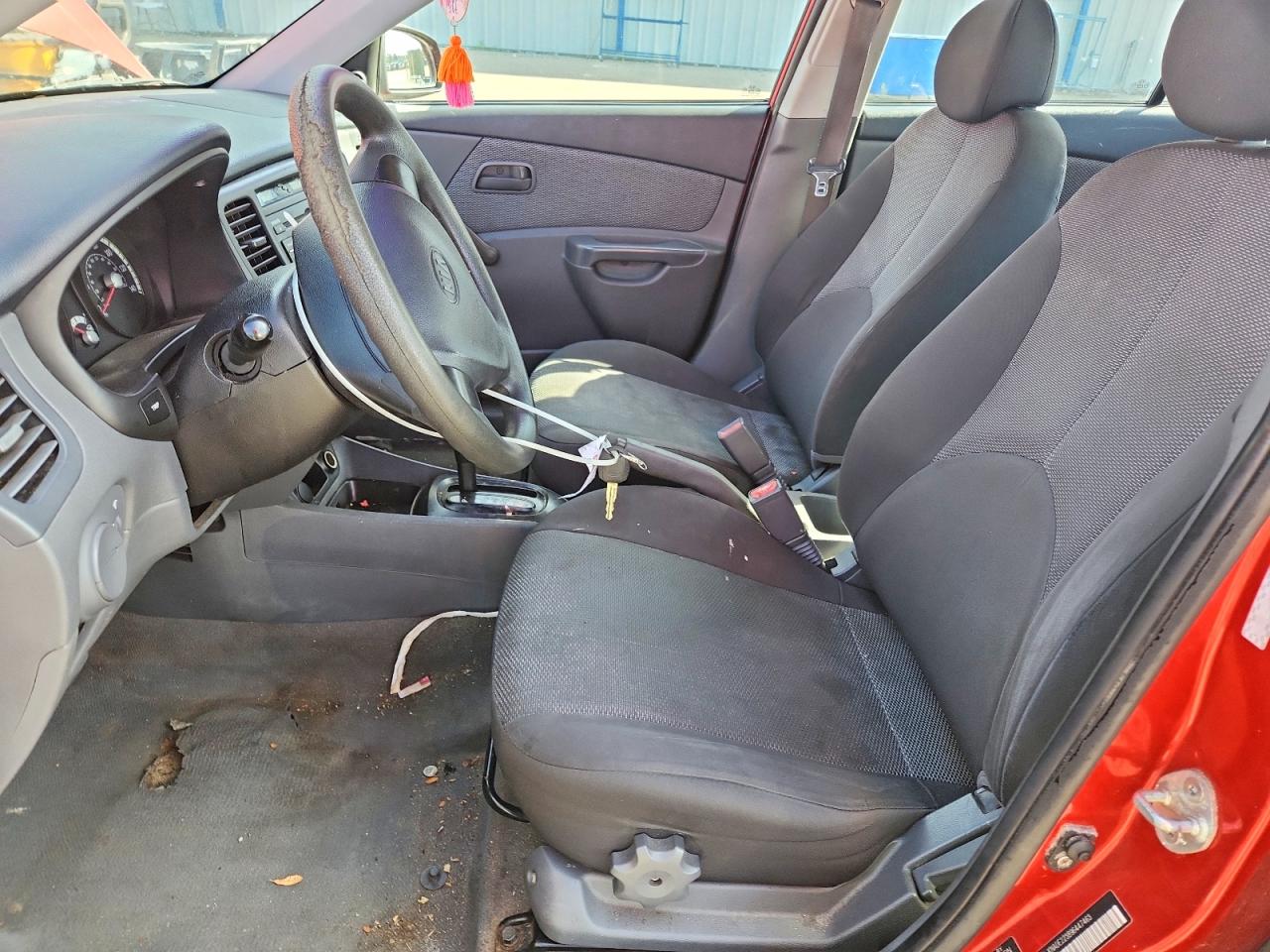 2009 Kia Rio Base Orange vin: KNADE223896447463