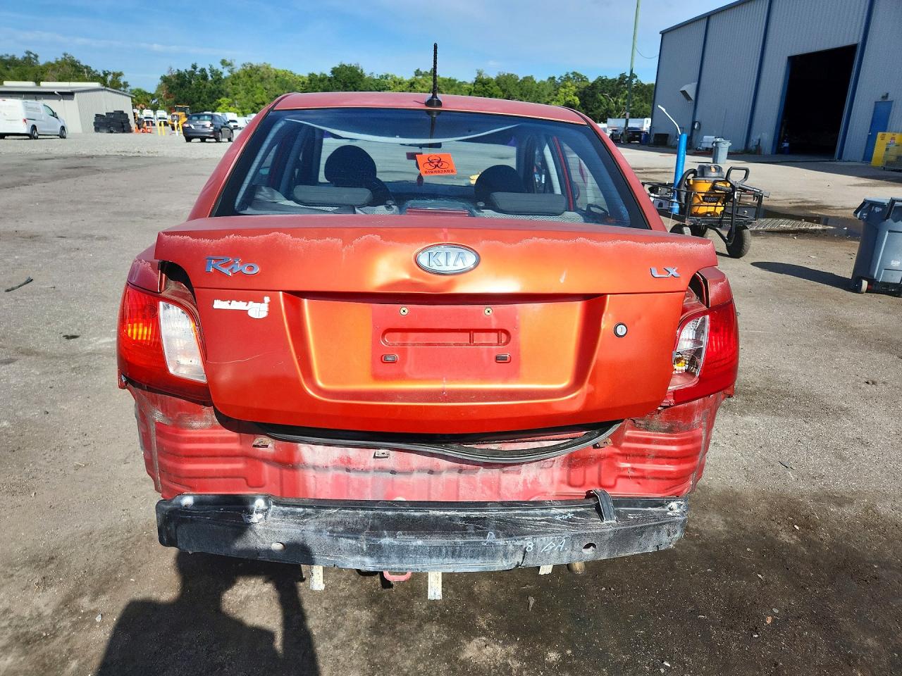 2009 Kia Rio Base Orange vin: KNADE223896447463
