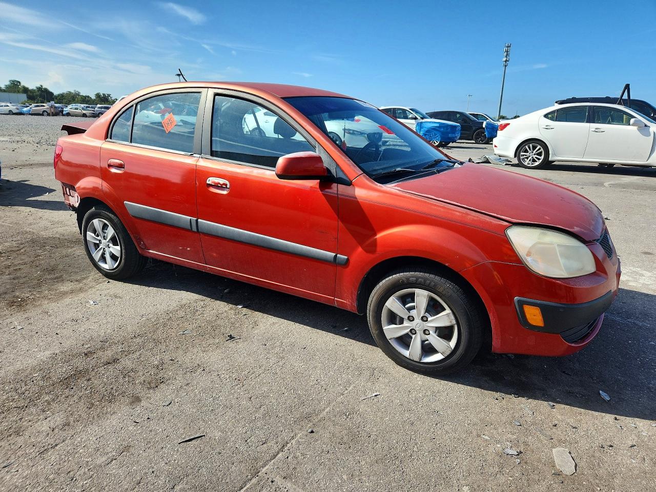 2009 Kia Rio Base Orange vin: KNADE223896447463