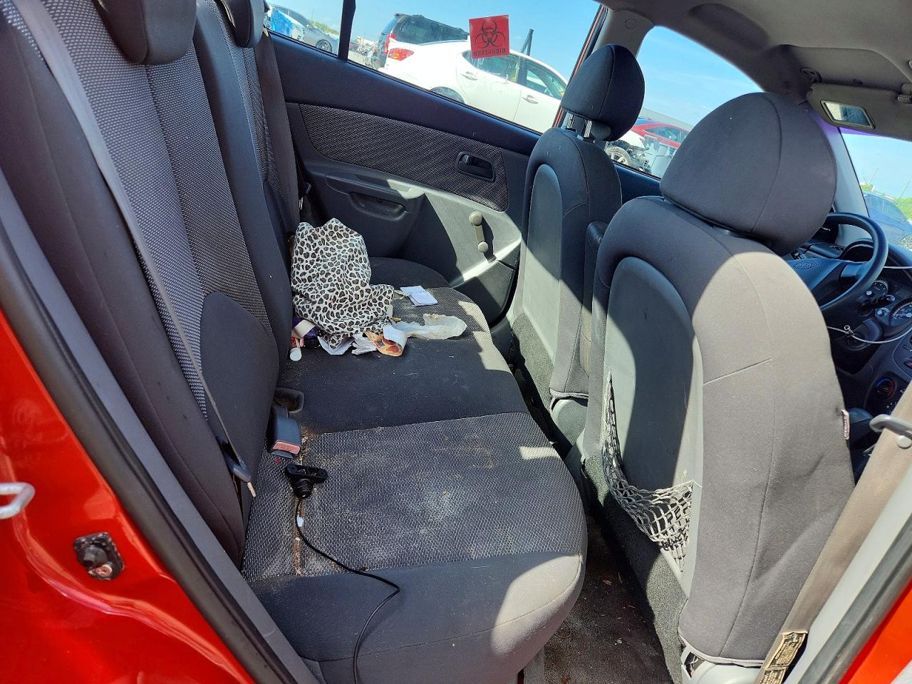 2009 Kia Rio Base Orange vin: KNADE223896447463