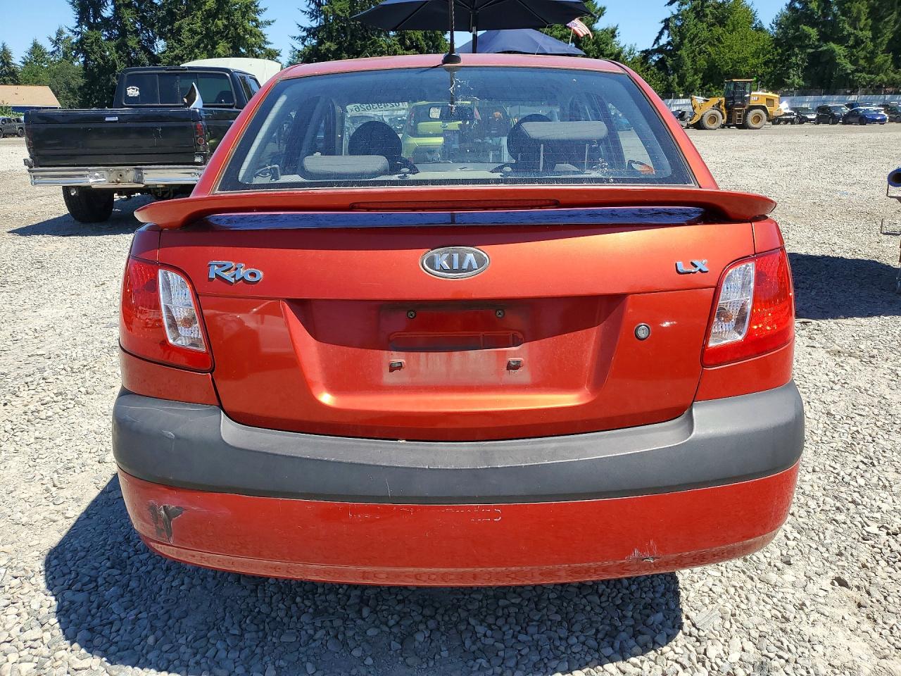 2009 Kia Rio Base Red vin: KNADE223896551029