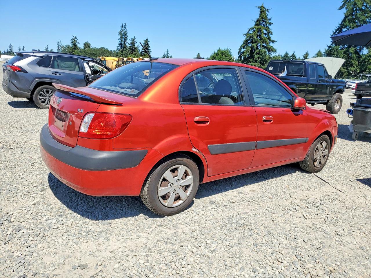 2009 Kia Rio Base Red vin: KNADE223896551029