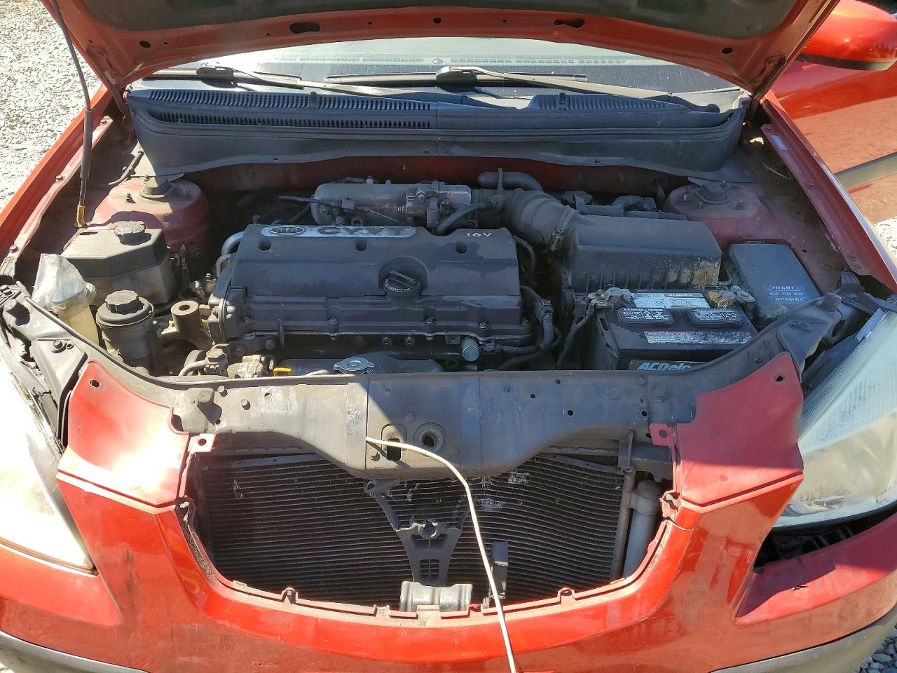 2009 Kia Rio Base Red vin: KNADE223896551029