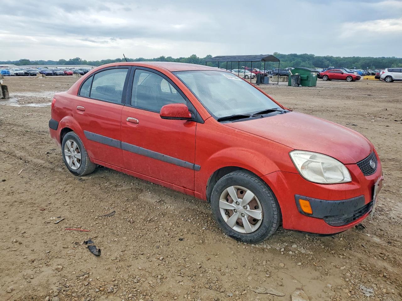 2009 Kia Rio Base Orange vin: KNADE223996499071