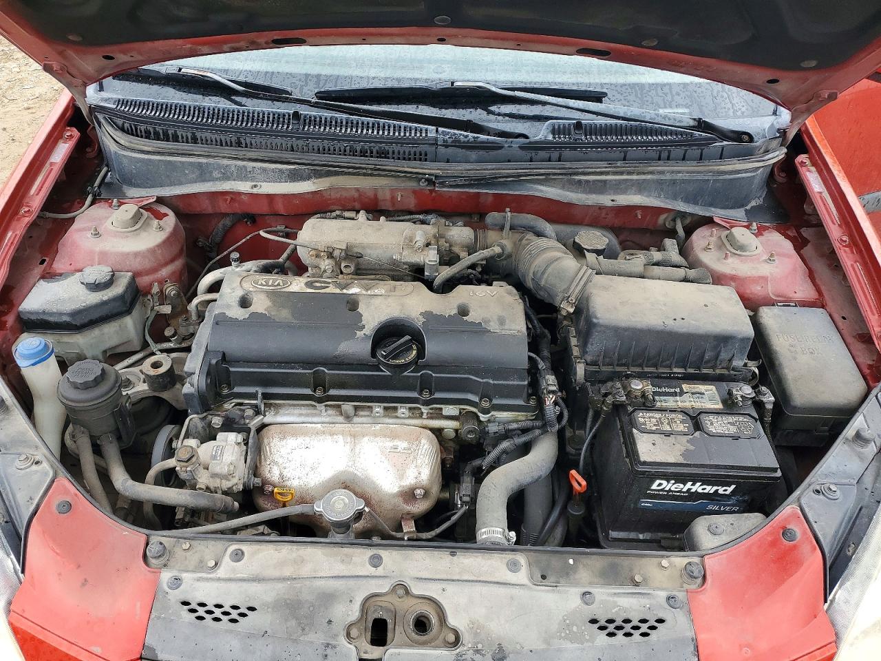 2009 Kia Rio Base Orange vin: KNADE223996499071