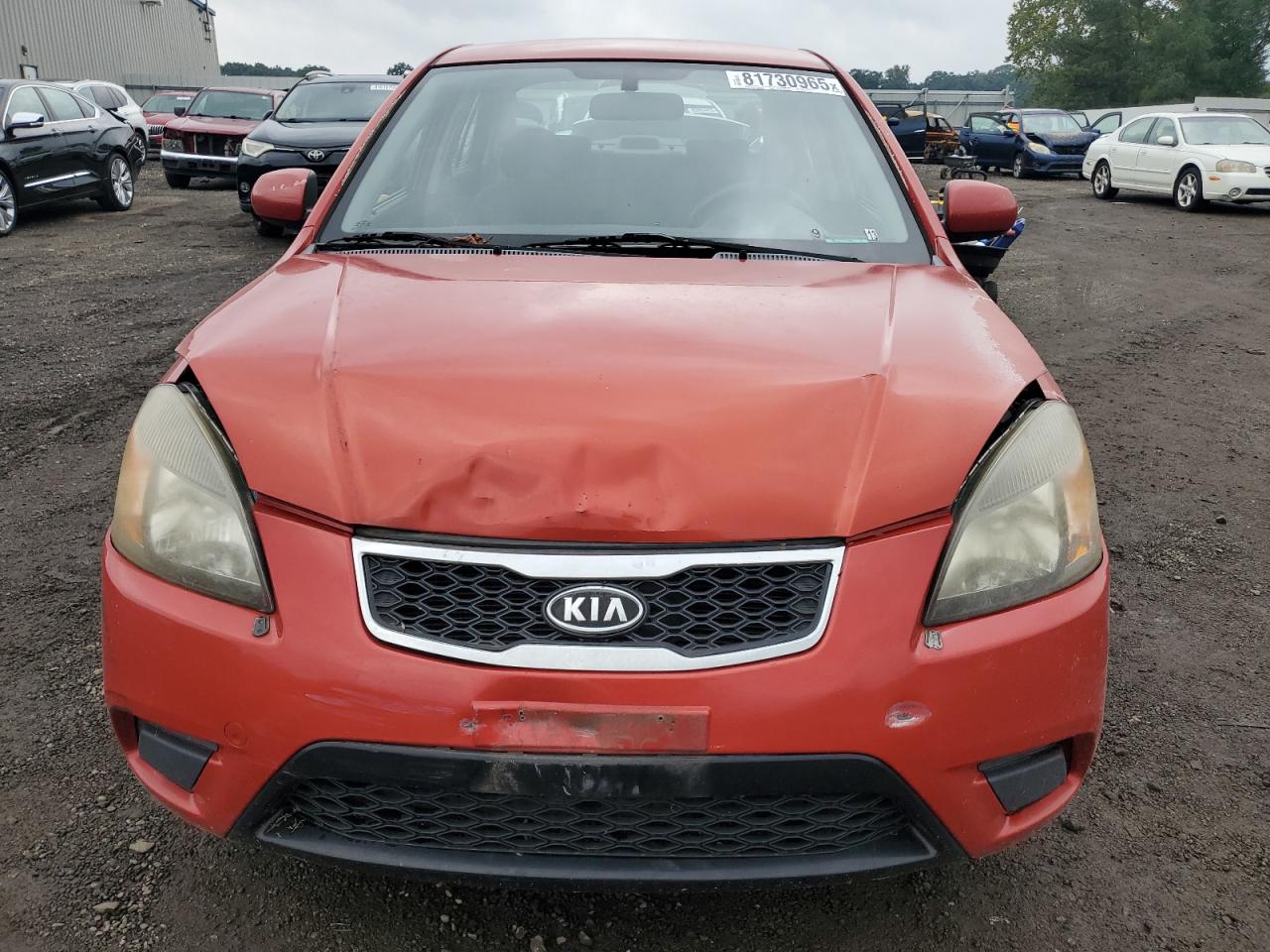 2011 Kia Rio Base Red vin: KNADH4A30B6730269