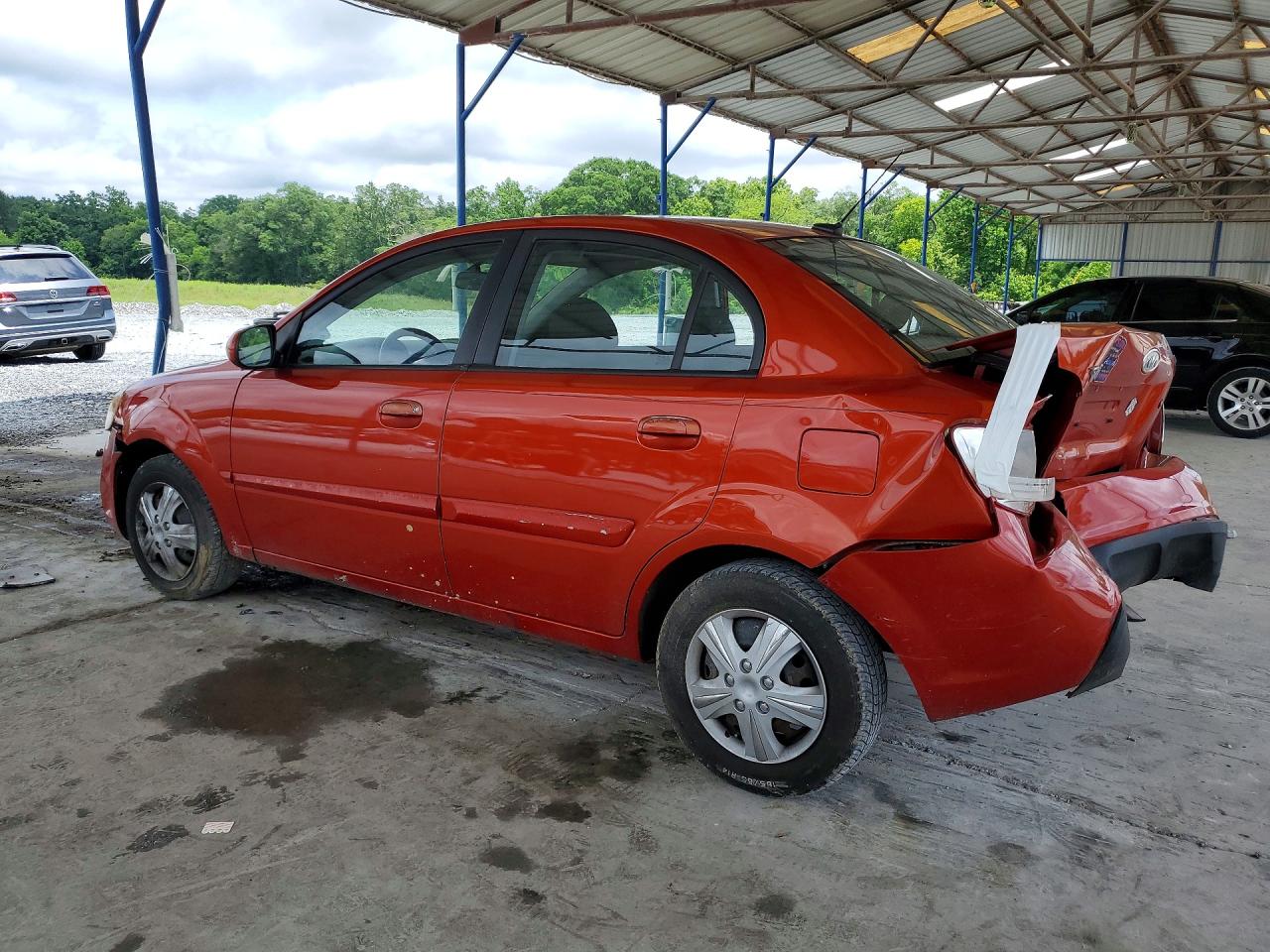 2010 Kia Rio Base Red vin: KNADH4A39A6640309