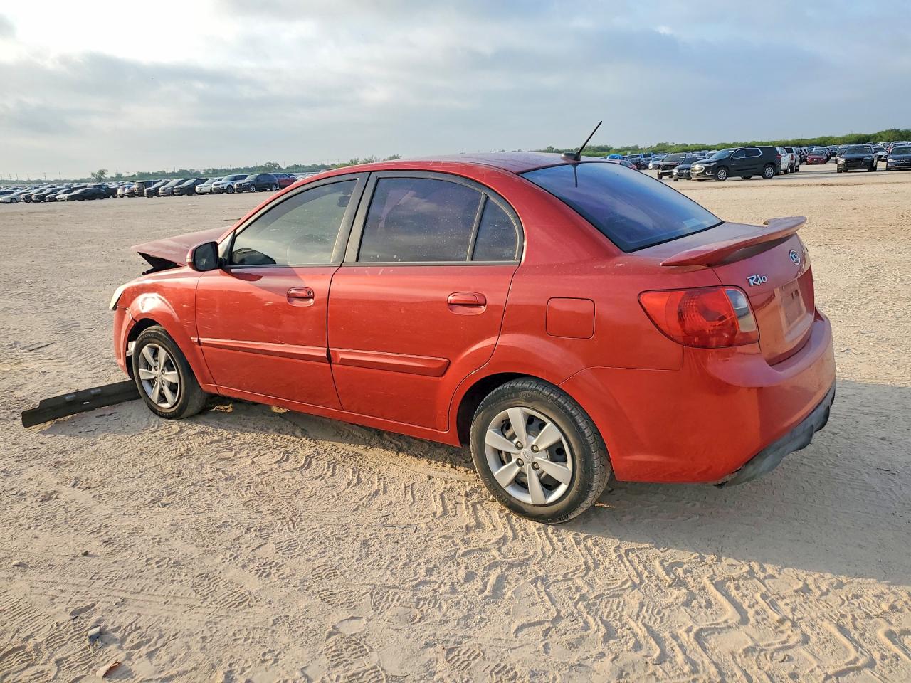2010 Kia Rio Base Red vin: KNADH4A3XA6661203