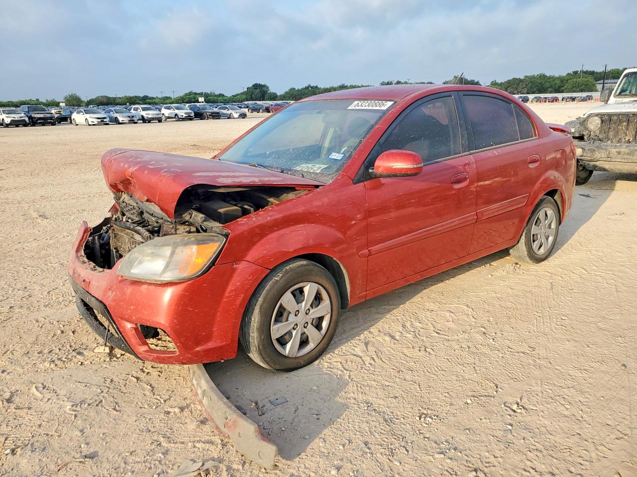 2010 Kia Rio Base Red vin: KNADH4A3XA6661203