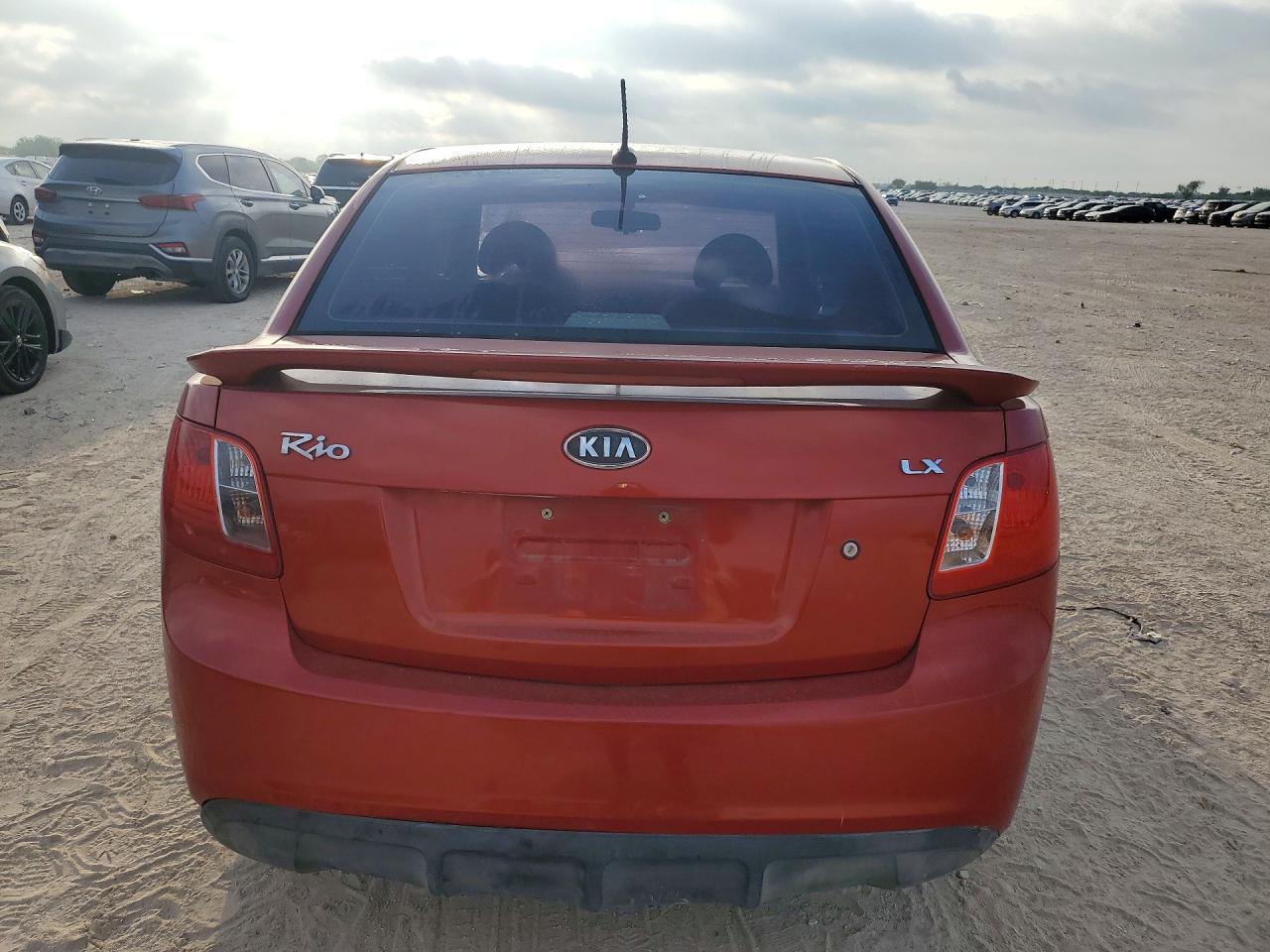 2010 Kia Rio Base Red vin: KNADH4A3XA6661203