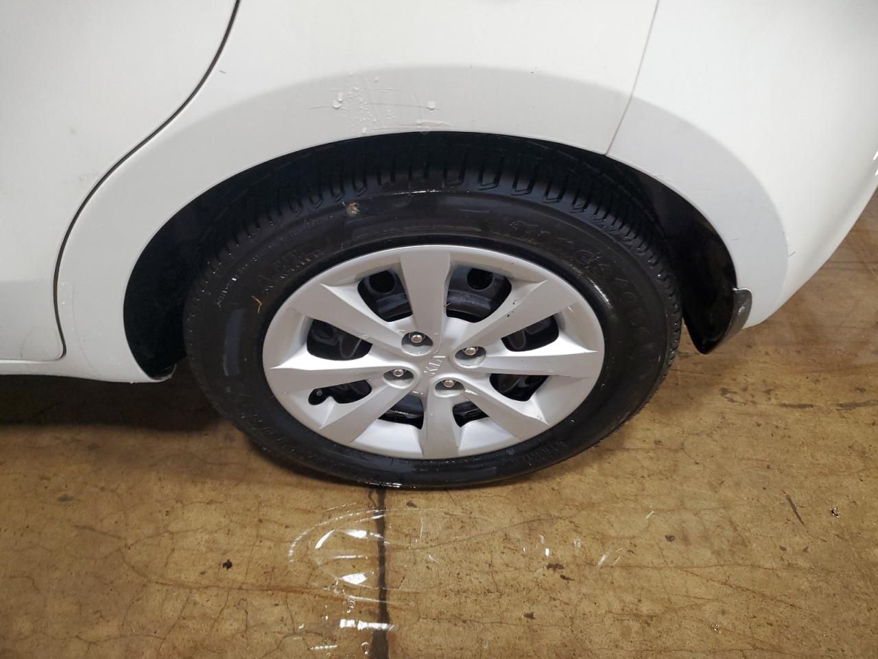2013 Kia Rio Lx White vin: KNADM5A3XD6301080 Damage: Left Rear Wheel Cover, Curb Rash, 2 To 3 Inches