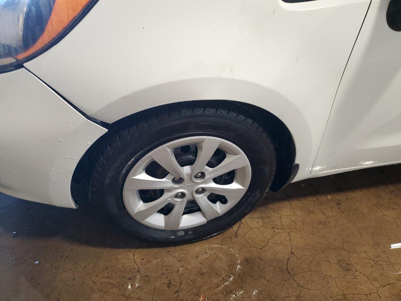 2013 Kia Rio Lx White vin: KNADM5A3XD6301080 Damage: Left Front Wheel Cover, Curb Rash, 1/2 To 1 Inch