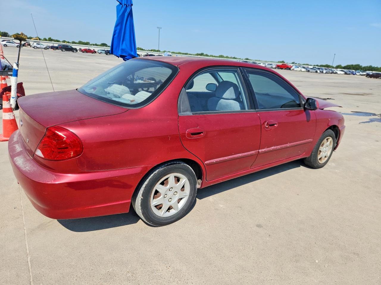 2004 Kia Spectra Base Burgundy vin: KNAFB121045303396