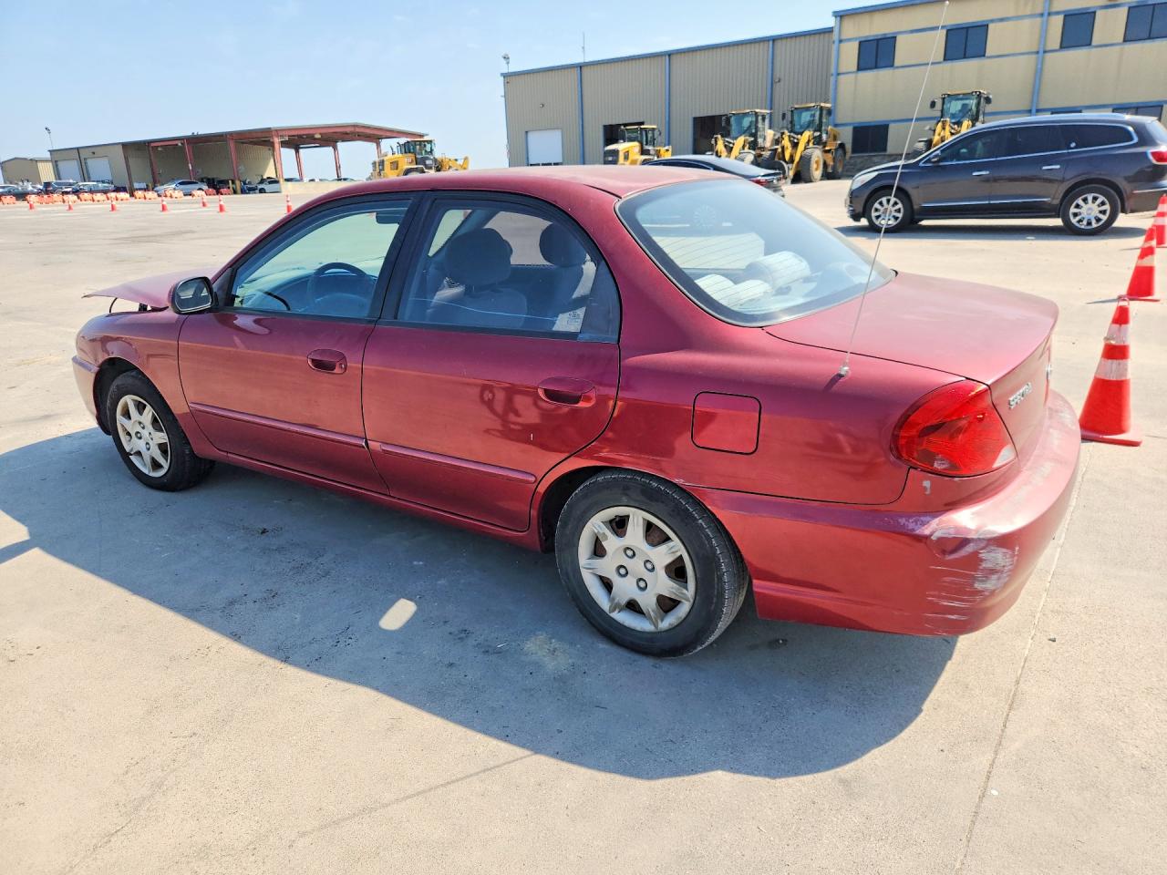 2004 Kia Spectra Base Burgundy vin: KNAFB121045303396
