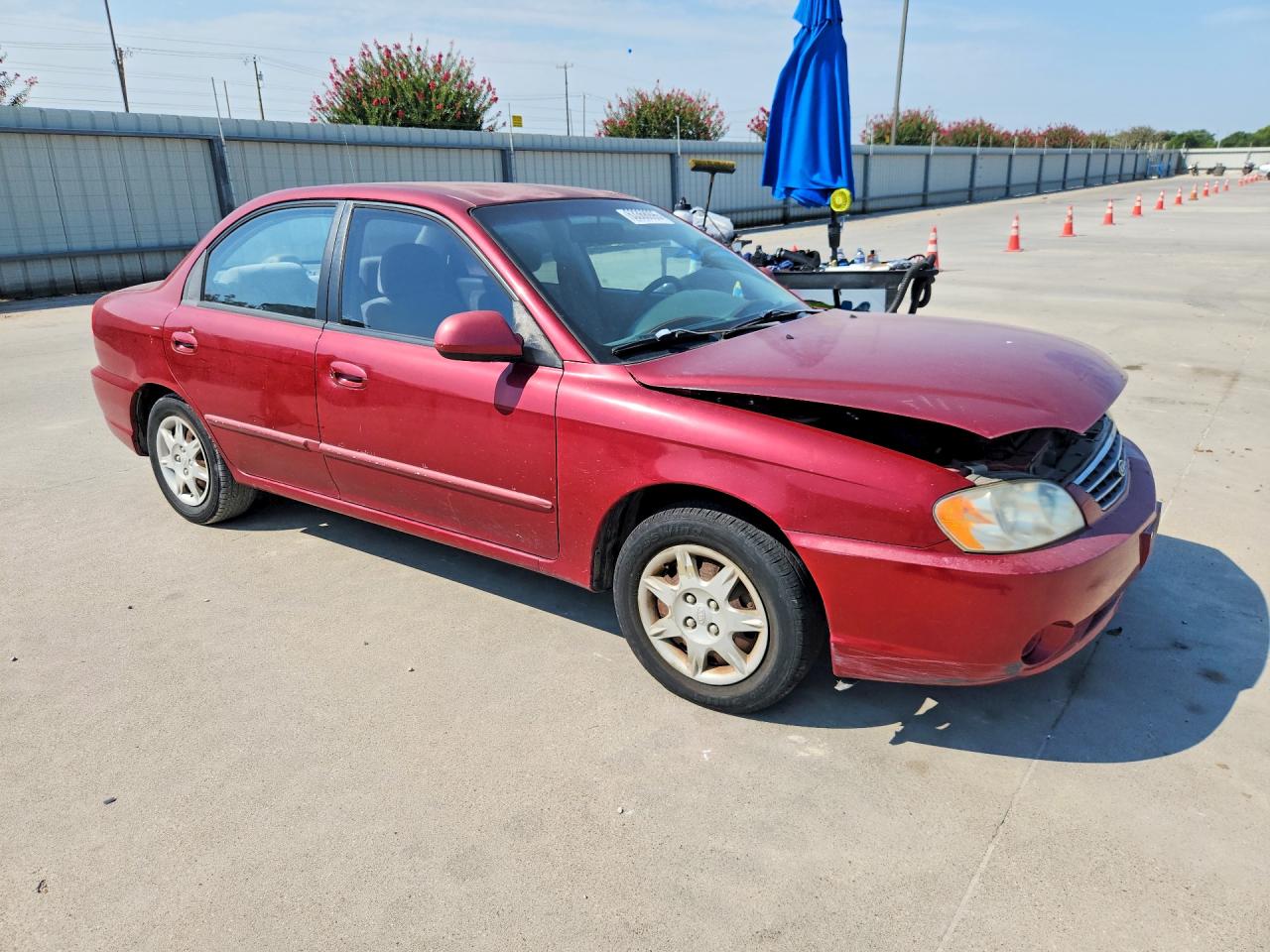2004 Kia Spectra Base Burgundy vin: KNAFB121045303396