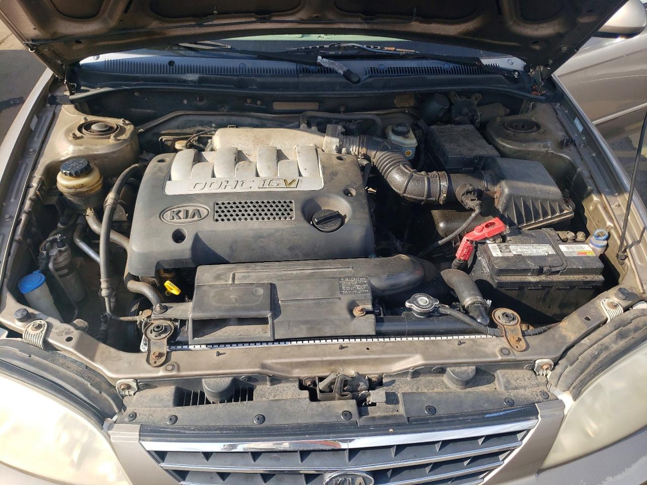 2002 Kia Spectra Base Tan vin: KNAFB121125155658