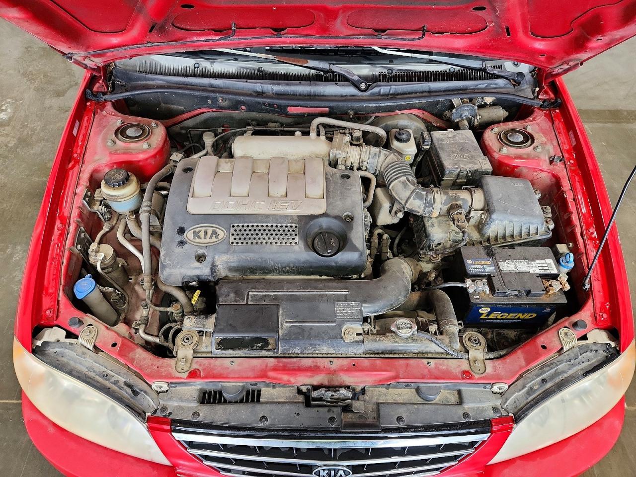 2004 Kia Spectra Base Red vin: KNAFB121545309971