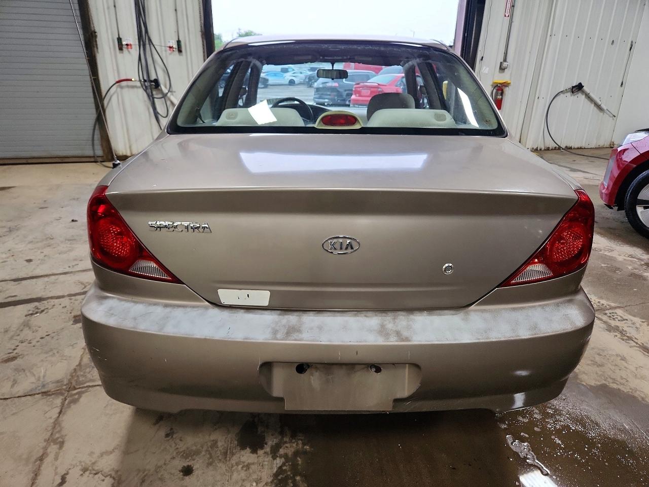 2003 Kia Spectra Base Желто-коричневый vin: KNAFB121835245231