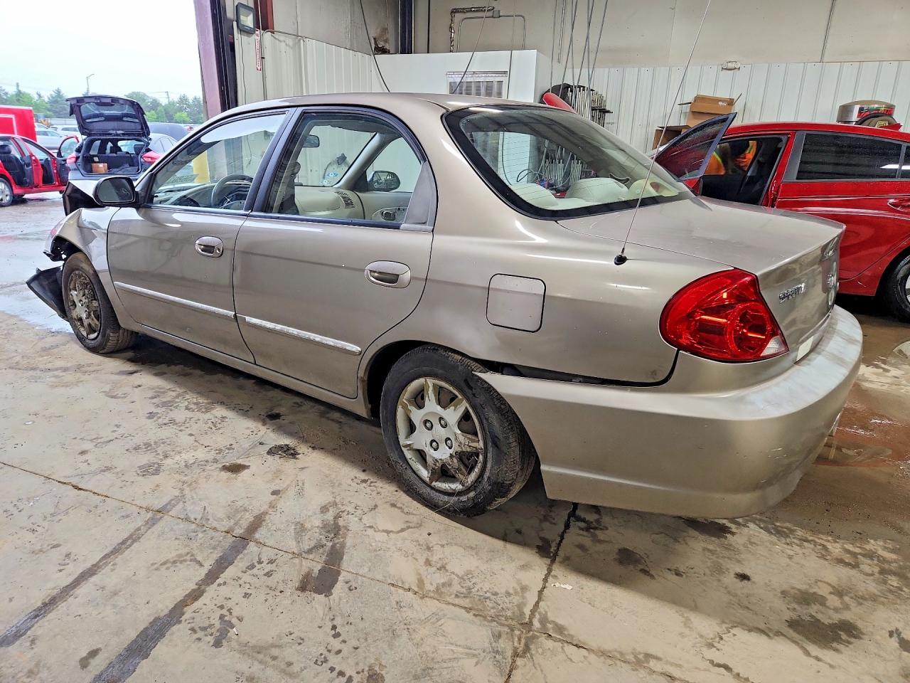2003 Kia Spectra Base Желто-коричневый vin: KNAFB121835245231