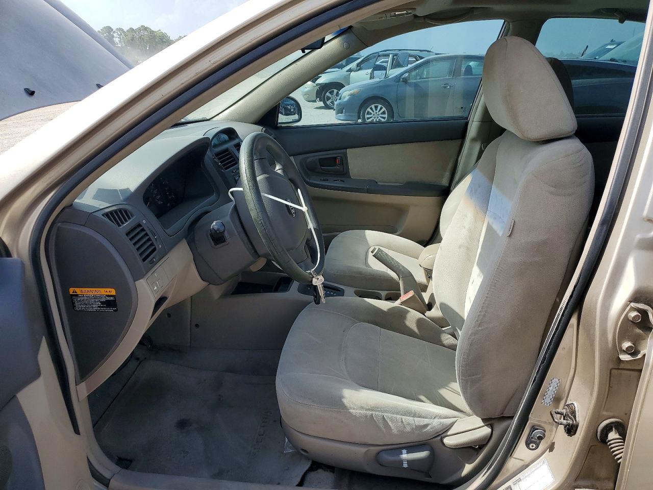 2005 Kia Spectra Lx Tan vin: KNAFE121855162053