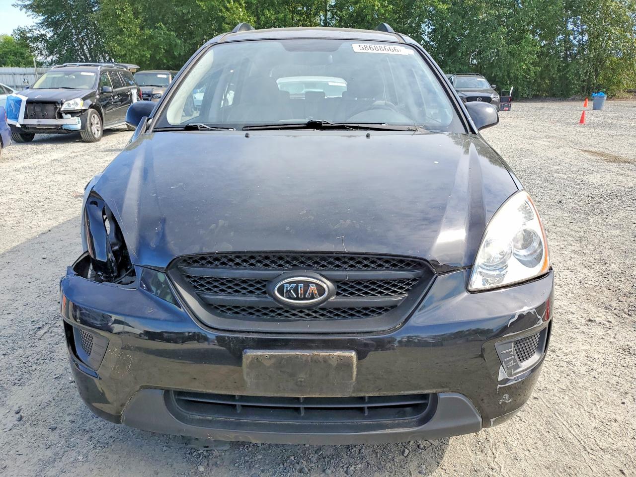 2009 Kia Rondo Base Черный vin: KNAFG528297224555