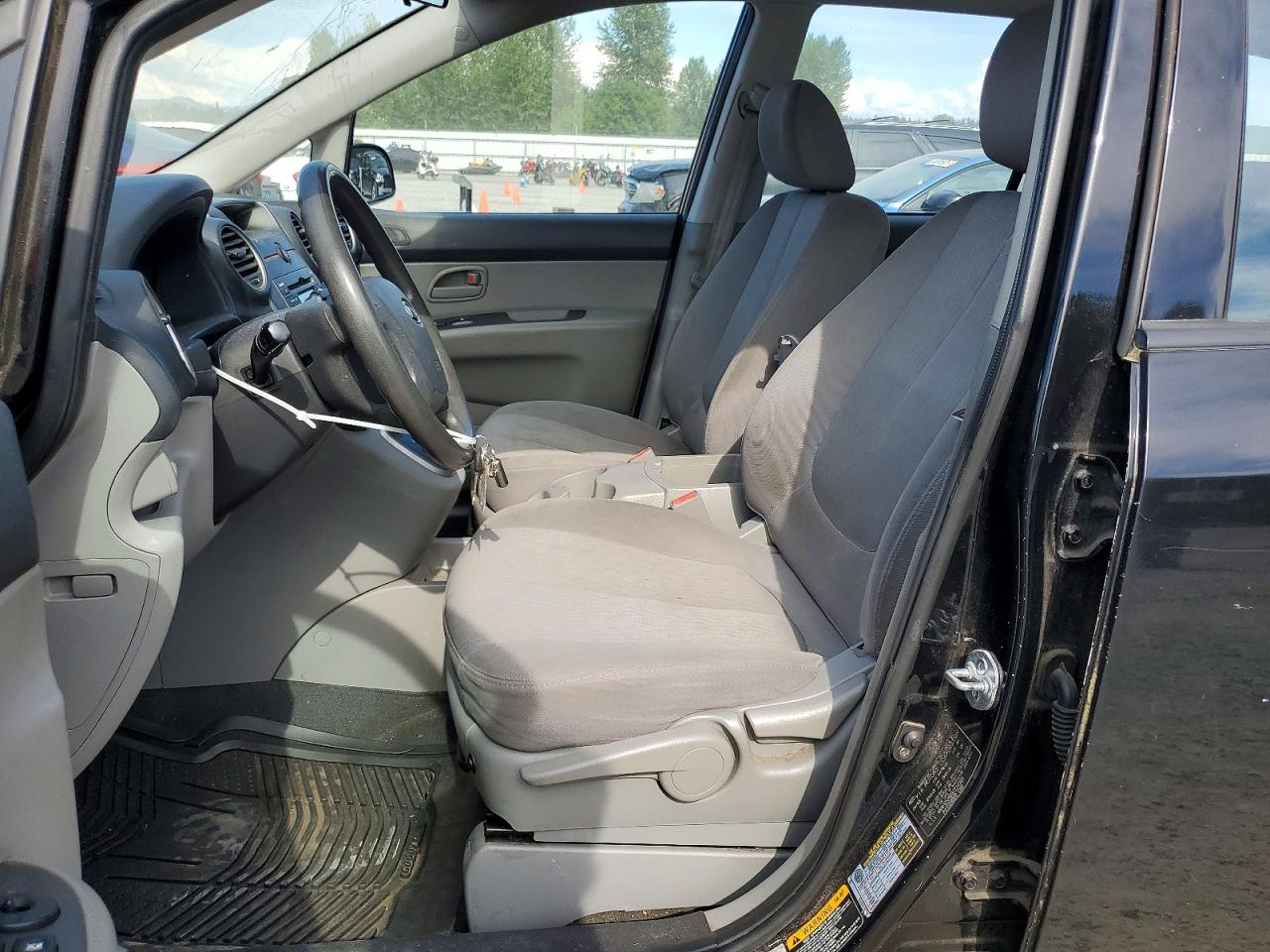 2009 Kia Rondo Base Черный vin: KNAFG528297224555