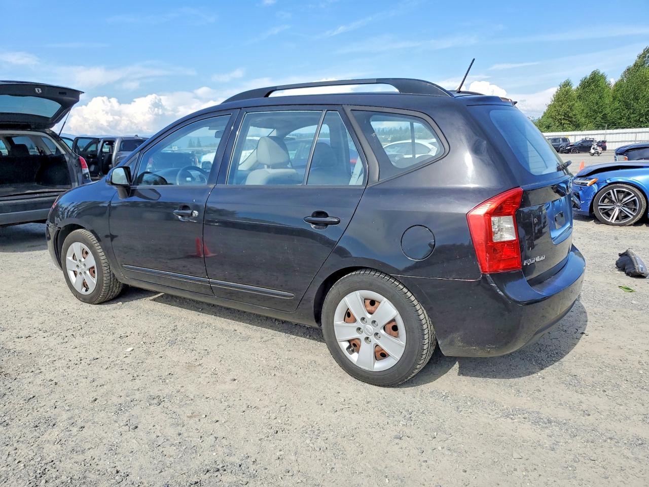 2009 Kia Rondo Base Черный vin: KNAFG528297224555