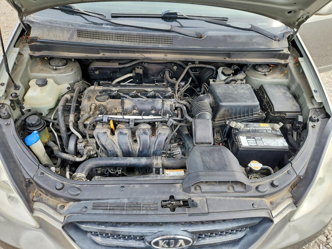 2009 Kia Rondo Base Золотой vin: KNAFG528297257796