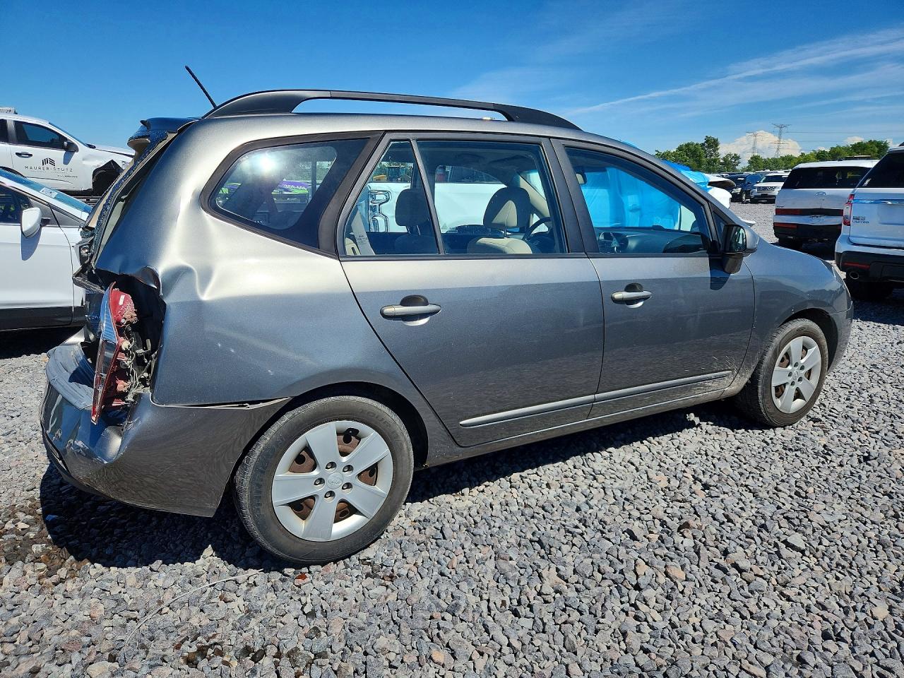 2009 Kia Rondo Base Желто-коричневый vin: KNAFG528297278664