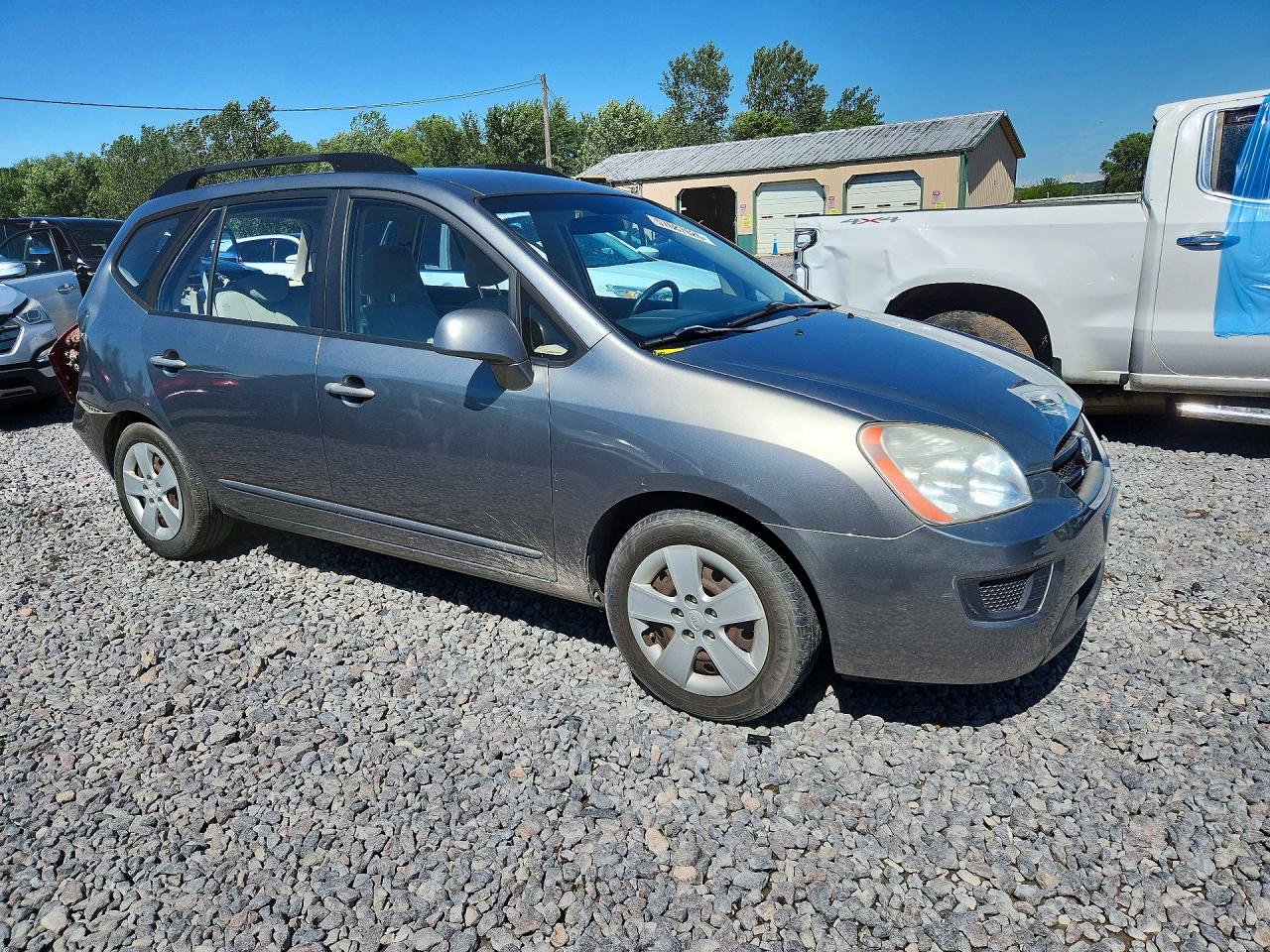 2009 Kia Rondo Base Желто-коричневый vin: KNAFG528297278664