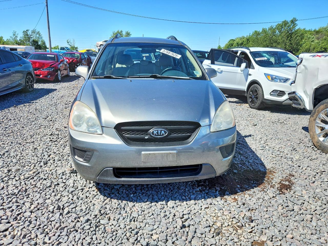 2009 Kia Rondo Base Желто-коричневый vin: KNAFG528297278664