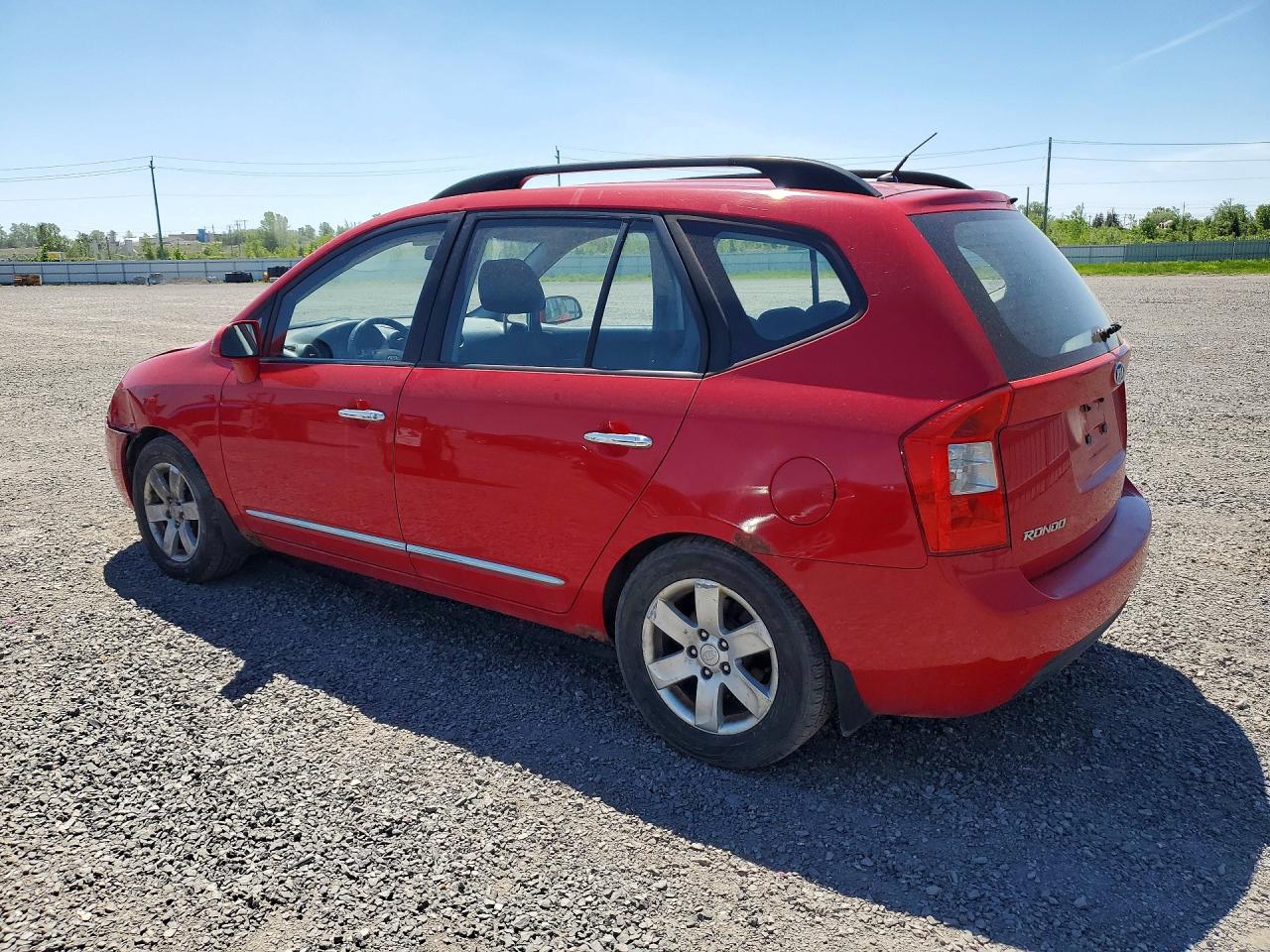 2009 Kia Rondo Base Красный vin: KNAFG528397275787
