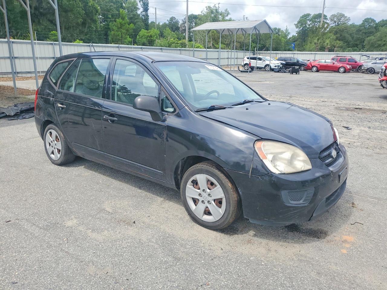 2009 Kia Rondo Base Черный vin: KNAFG528497273269