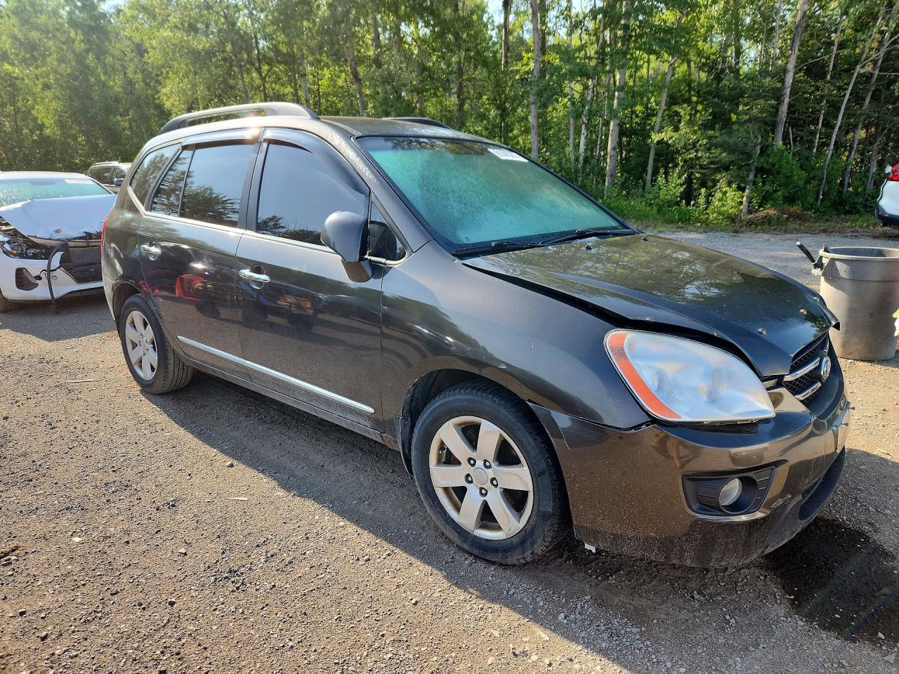 2009 Kia Rondo Base Brown vin: KNAFG528697294124