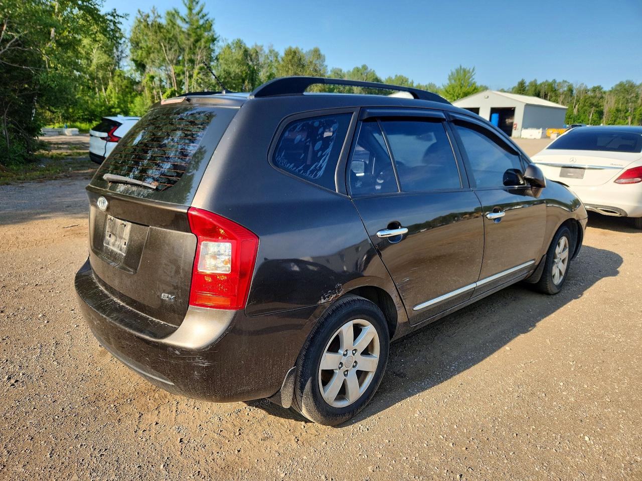 2009 Kia Rondo Base Brown vin: KNAFG528697294124