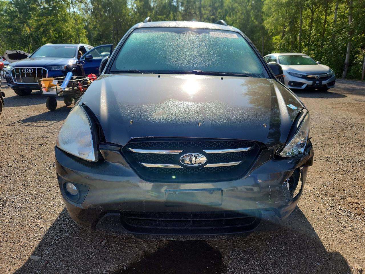 2009 Kia Rondo Base Brown vin: KNAFG528697294124