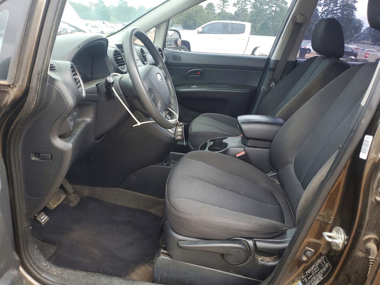 2009 Kia Rondo Base Коричневый vin: KNAFG528797266171