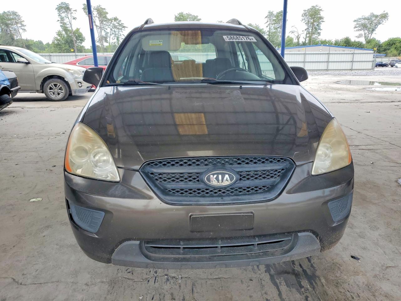 2009 Kia Rondo Base Brown vin: KNAFG528997264597