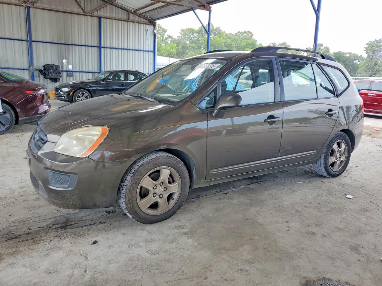 2009 Kia Rondo Base Brown vin: KNAFG528997264597